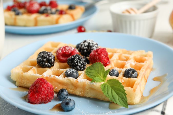 Composition of breakfast with belgian waffles, space for text