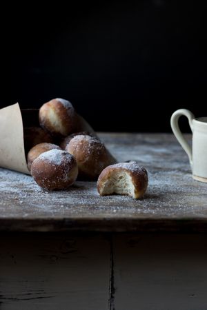 Baked cakes in craft paper on table