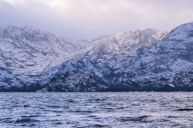 Shore with mountains near water