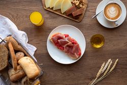 Stylish serving dishes with sandwich for breakfast