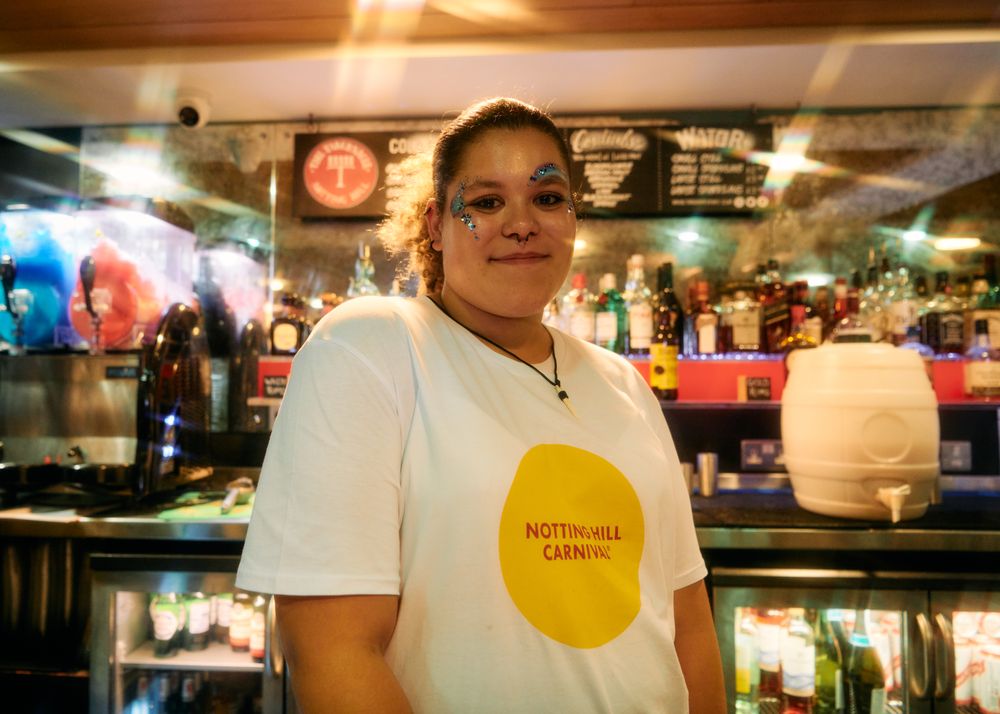 London, England, United Kingdom - August 28, 2022: Woman with unique eye make up behind bar