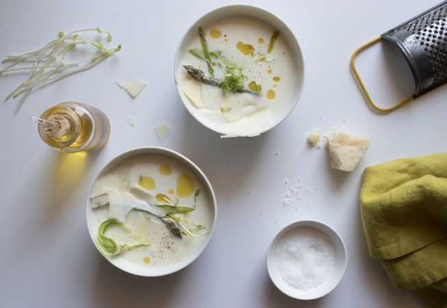 Kitchenware and condiments near asparagus cream soup