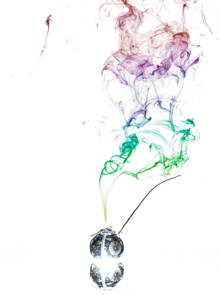 Jar with herbs emitting smoke