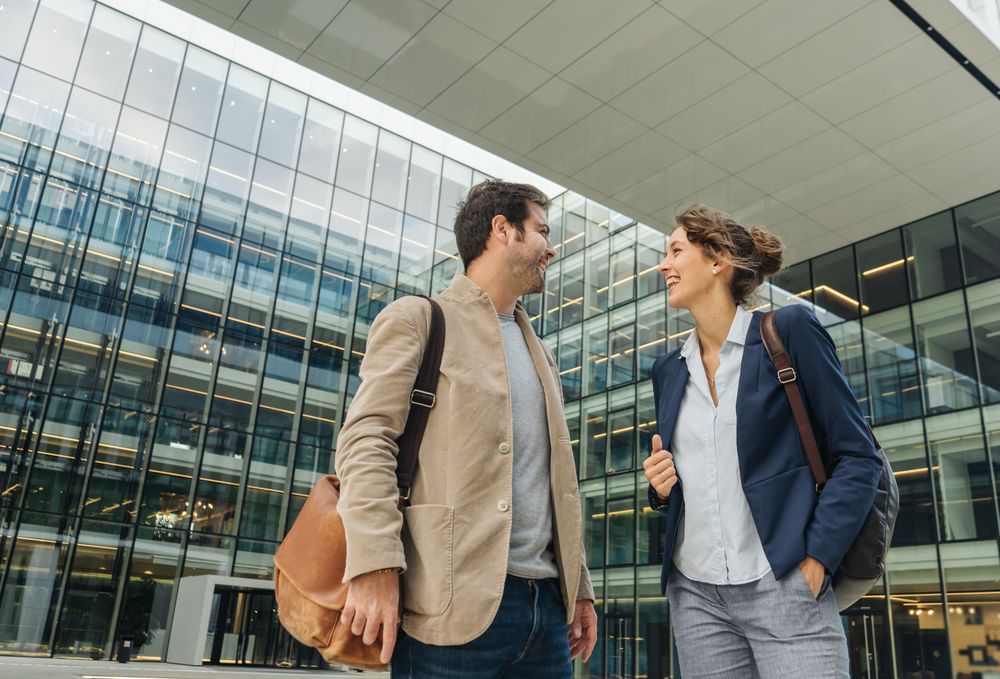 Positive businesspeople walking from work together