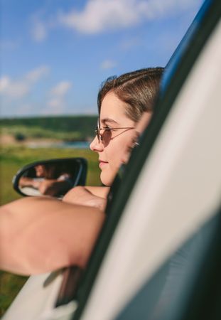 Woman leaning on window of the car