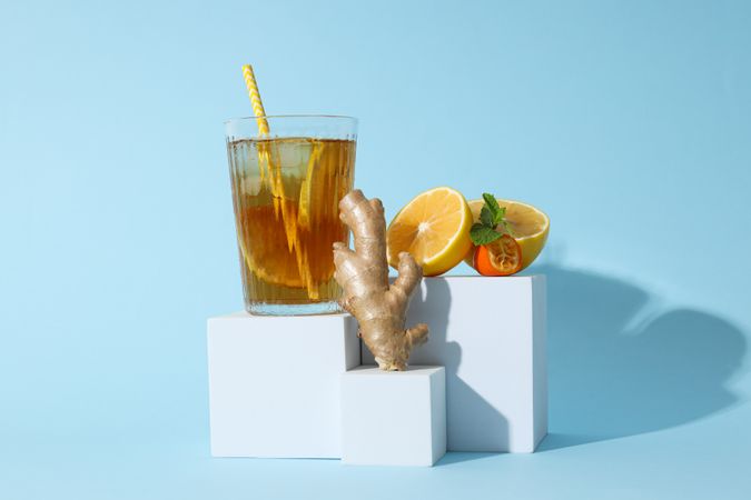 A glass of cold tea on a blue background