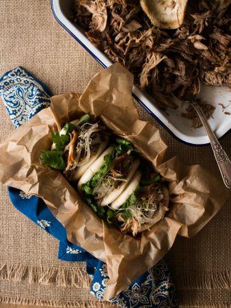 Container with puller pork and bao bun