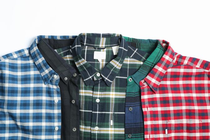 Different beautiful shirts on blank background, copy space