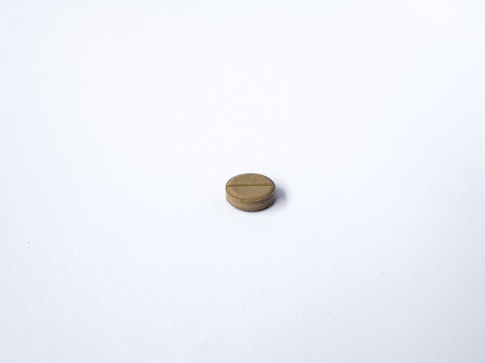Brown Medicine Tablet Isolated on blank Background