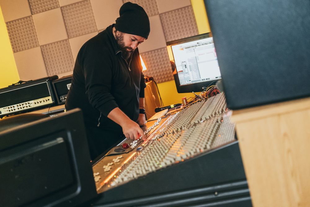 Man in a equalizer instrument in a studio