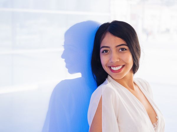 Young woman in beautiful dress smiling