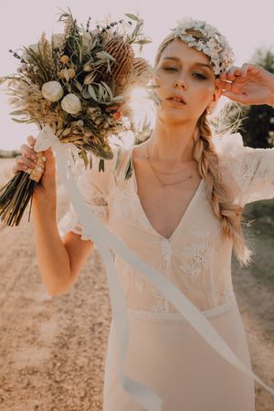 Woman in dress with flower bouquet