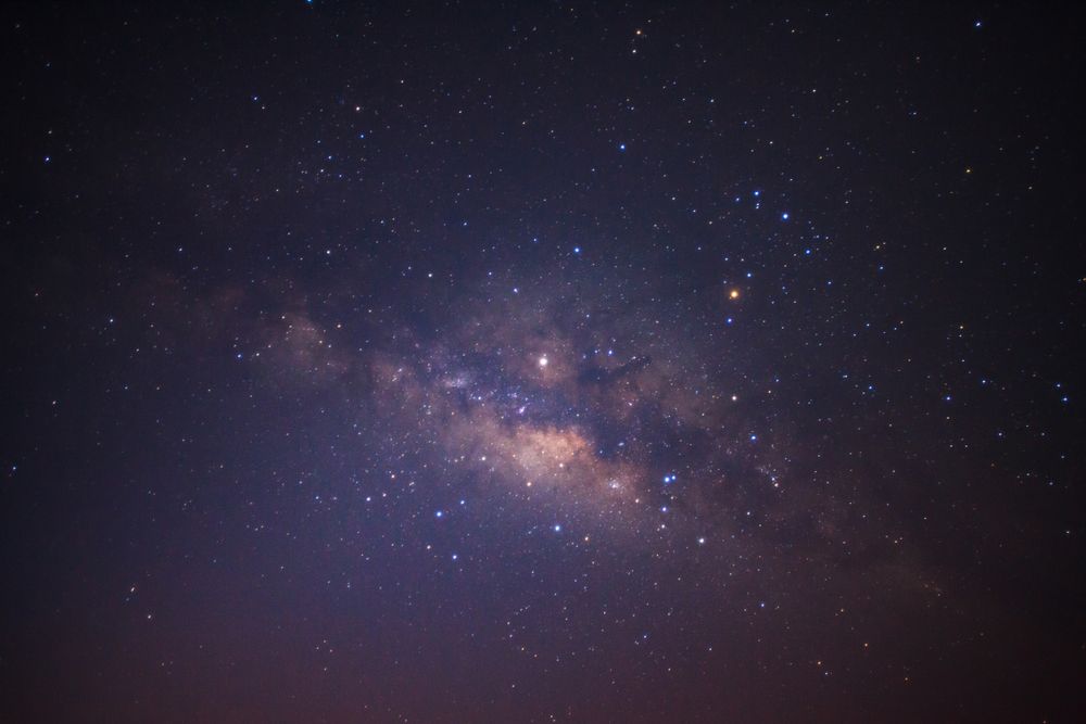 Milky way galaxy with stars and space dust in the universe, Long exposure photograph, with grain.