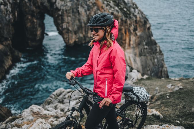 Female bicyclist on rocks