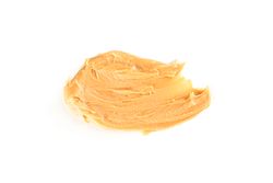 Creamy peanut butter isolated on bright background. A traditional product of American cuisine
