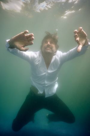 Man drowning in deep water in pool