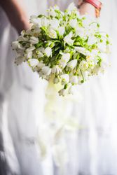Woman holding bouquet with snowdrops