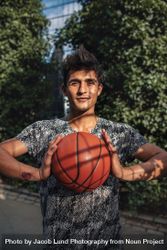 Young basketball player holding a ball 5ngkJM
