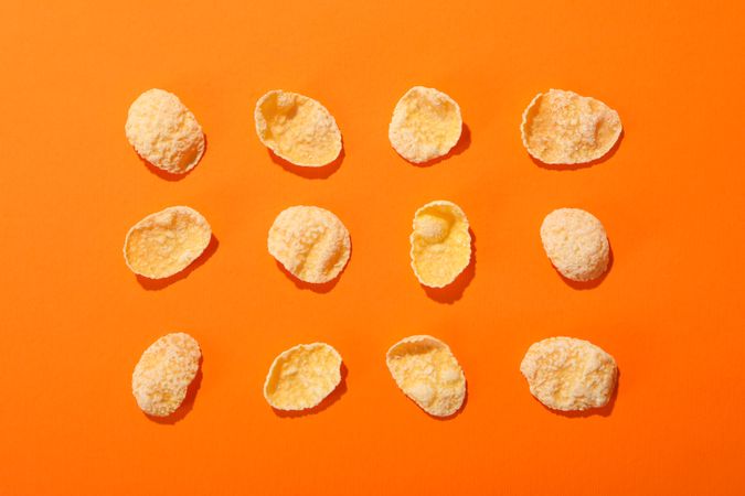 Flat lay with muesli on orange background