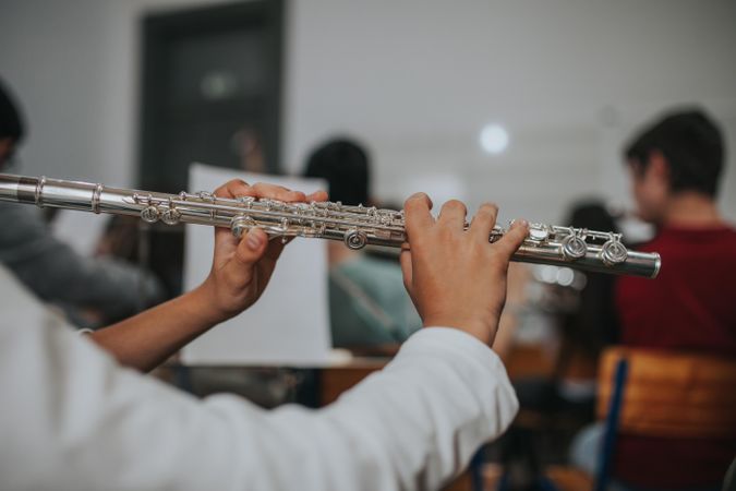 Close up of student playing the flute during band practice