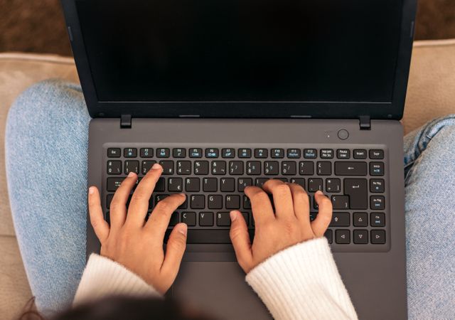 Home Productivity: Unrecognizable Woman Working on Laptop