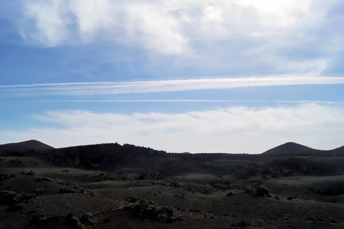 Picturesque view of volcanic terrain with solidified lava in wild area