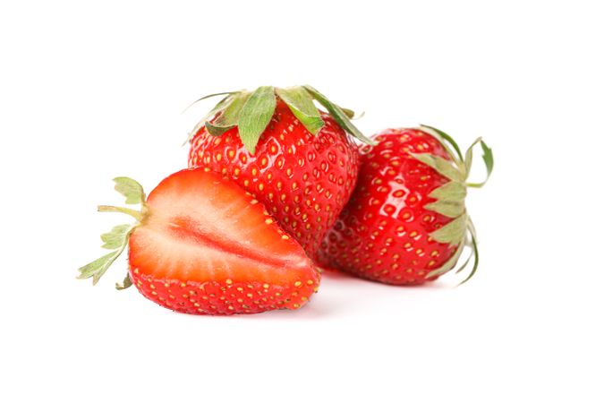 Strawberries isolated on light background. Summer sweet fruits and berries