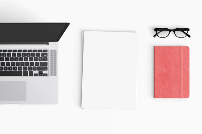 Modern workspace with coffee cup, smartphone, paper, notebook, tablet and laptop copy space