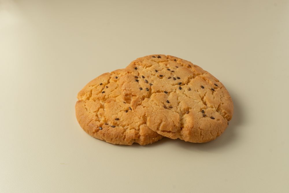 Sesame topped cookies arranged neatly