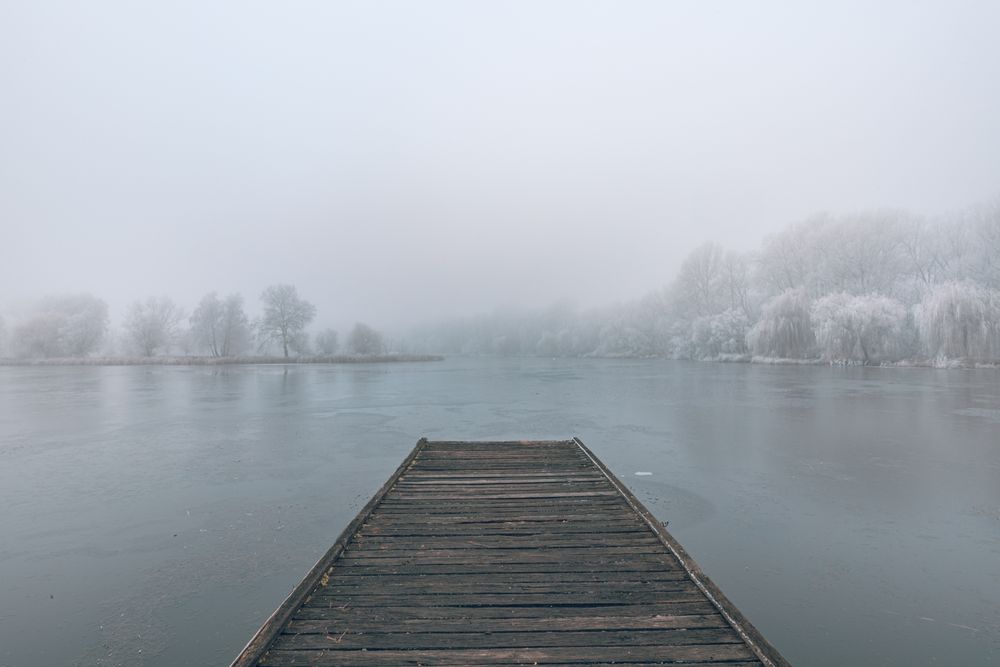 Dock of a lake on a wintry day