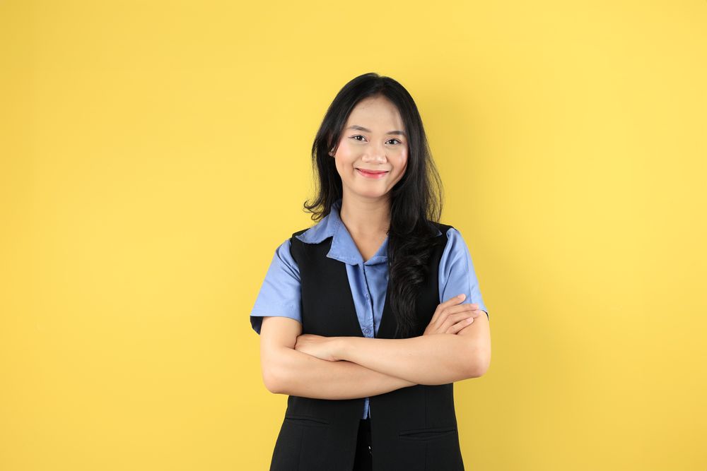 Portrait of the Young Asian Businesswoman with Arms Crossed