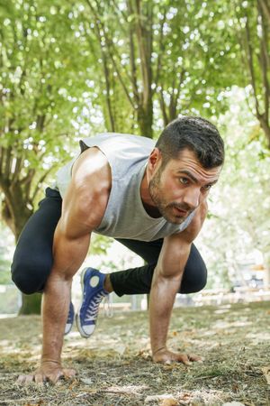 Sporty man training in park