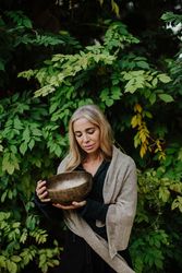 Romantic woman with musical bowl in castle