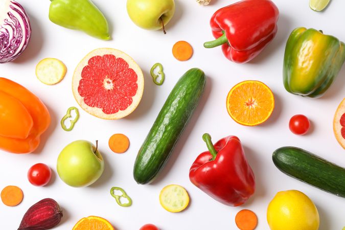 Different vegetables and fruits on blank background, top view