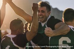 Rugby team cheering and celebrating victory 4BOkMb