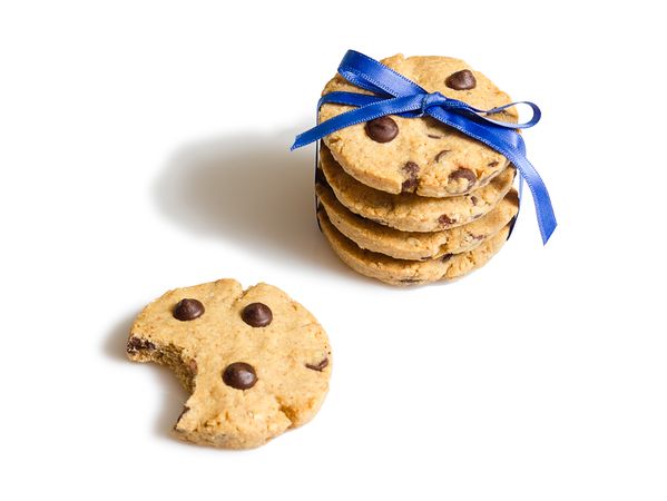 Closeup of chocolate chip cookies pile isolated on blank background