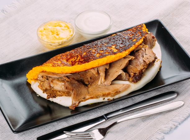 Cachapa, typical Venezuelan dish made with corn and stuffed with cheese and pork