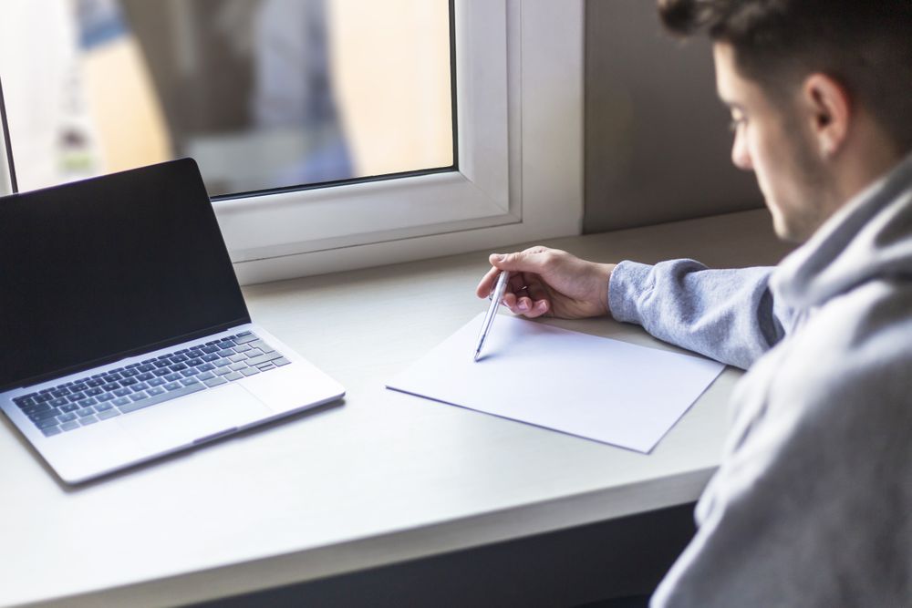 Young student writing in a notebook
