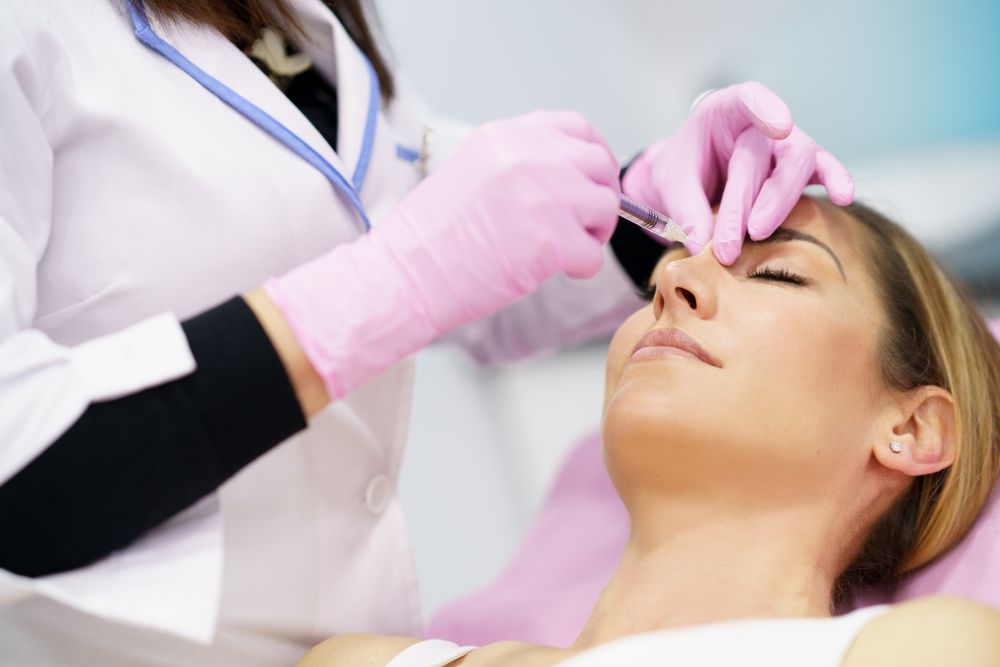 Woman having her brow injected