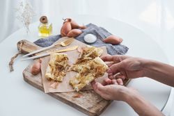 Anonymous person eating onion tart