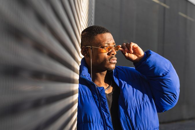 Stylish Black man in sunglasses on street