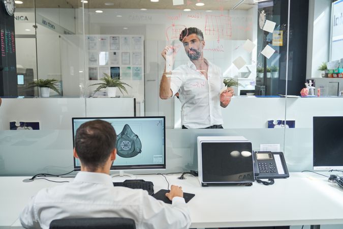 Male scientists working together and developing protect mask