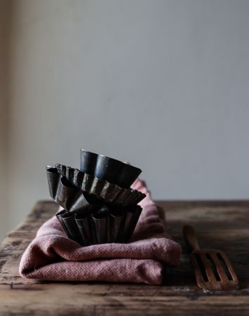Bakery forms on napkin near paddle on table