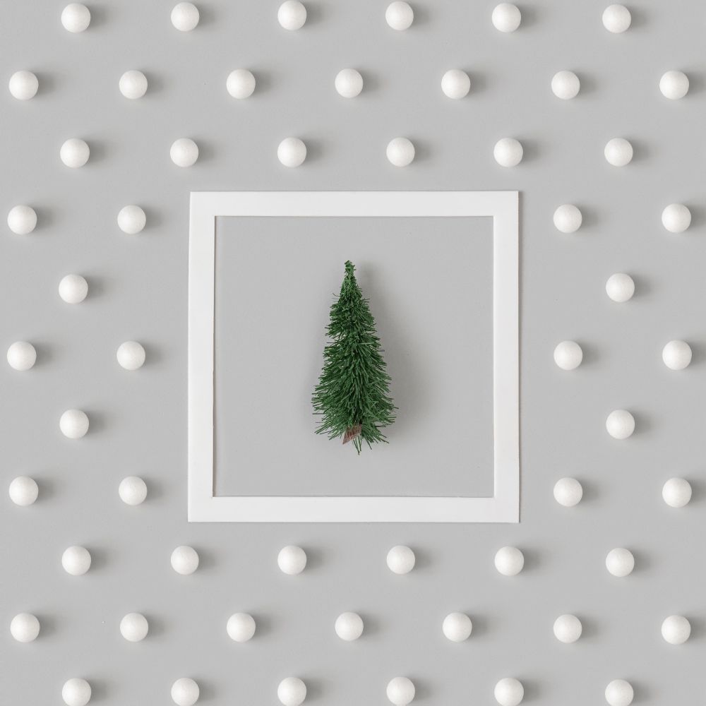 Holiday pattern with tree and snowballs on gray background