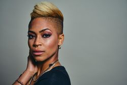 Closeup portrait of serious Black woman with septum piercing, with copy space