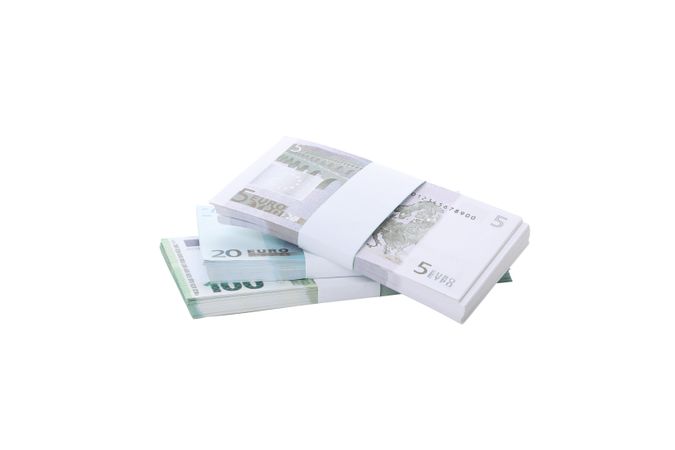 Stacks of American cash money, isolated on light background