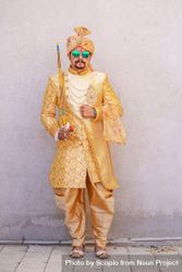 Indian man wearing traditional wedding outfit bxmaB0