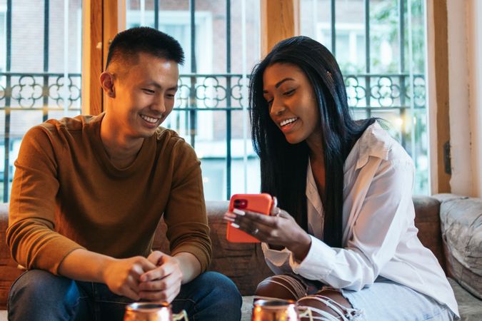 Asian man and Black Latina woman on a date