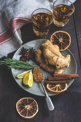 Raw ginger & fragrant herbs and on plate