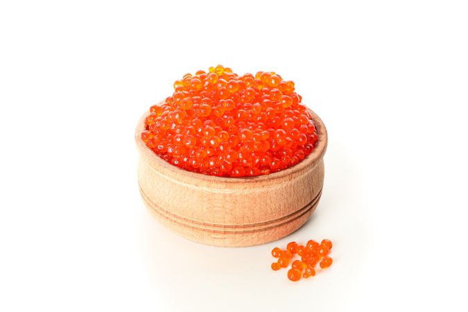 Wooden bowl with caviar isolated on plain background